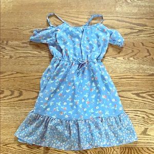 A girls dress with small flower designs